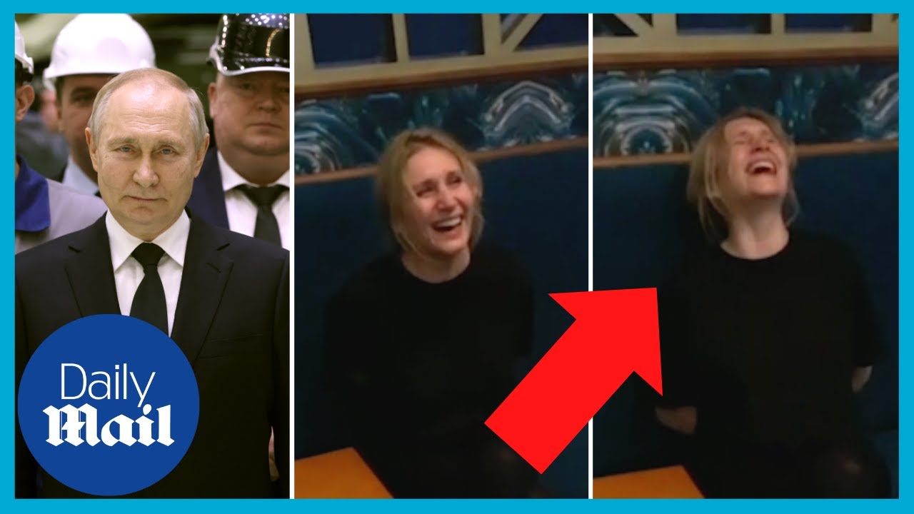Russian woman jailed for criticising putin laughs maniacally at prison guard 7